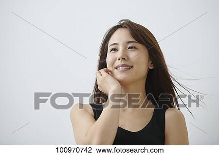 Studio portrait of attractive young Japanese woman View Large Photo Image Stock Image - Studio portrait of attractive young Japanese woman. Fotosearch