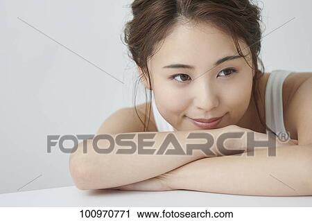 Studio portrait of attractive young Japanese woman View Large Photo Image Stock Image - Studio portrait of attractive young Japanese woman. Fotosearch
