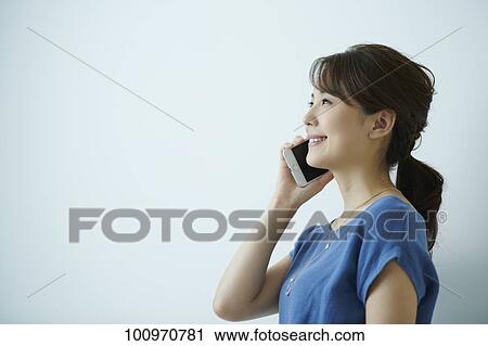 Studio portrait of attractive young Japanese woman View Large Photo Image Stock Image - Studio portrait of attractive young Japanese woman. Fotosearch