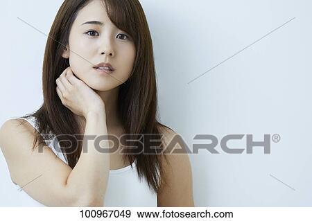 Studio portrait of attractive young Japanese woman View Large Photo Image Stock Photo - Studio portrait of attractive young Japanese woman. Fotosearch