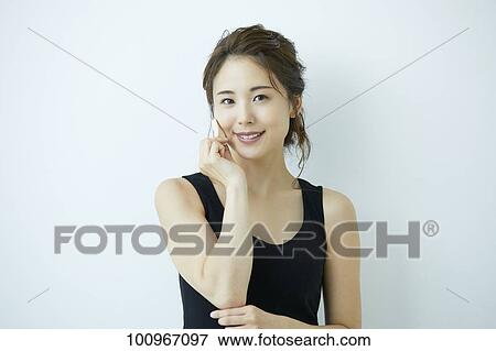 Studio portrait of attractive young Japanese woman View Large Photo Image Stock Photo - Studio portrait of attractive young Japanese woman. Fotosearch
