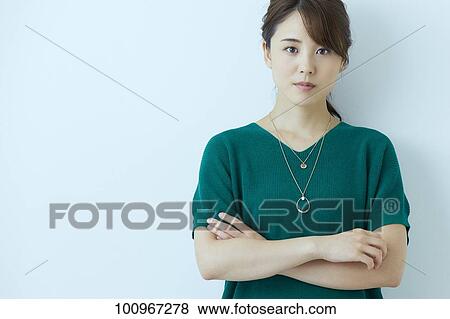 Stock Photo - Studio portrait of attractive young Japanese woman. Fotosearch