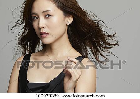 Studio portrait of attractive young Japanese woman View Large Photo Image Stock Photo - Studio portrait of attractive young Japanese woman. Fotosearch