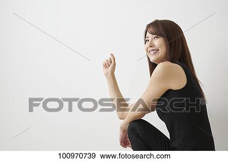 Studio portrait of attractive young Japanese woman View Large Photo Image Stock Photo - Studio portrait of attractive young Japanese woman. Fotosearch