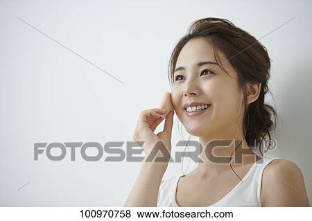 Studio portrait of attractive young Japanese woman View Large Photo Image Stock Photo - Studio portrait of attractive young Japanese woman. Fotosearch