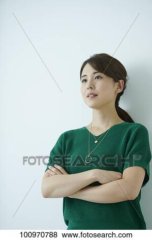 Stock Photo - Studio portrait of attractive young Japanese woman. Fotosearch