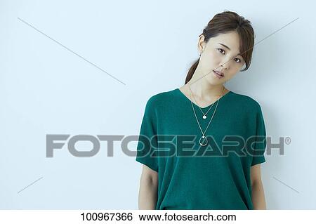Studio portrait of attractive young Japanese woman View Large Photo Image Stock Photograph - Studio portrait of attractive young Japanese woman. Fotosearch