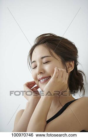 Studio portrait of attractive young Japanese woman View Large Photo Image Stock Photograph - Studio portrait of attractive young Japanese woman. Fotosearch