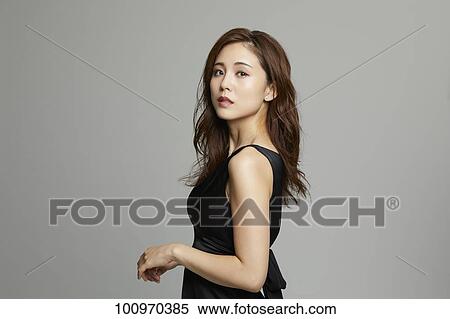 Studio portrait of attractive young Japanese woman View Large Photo Image Stock Photography - Studio portrait of attractive young Japanese woman. Fotosearch