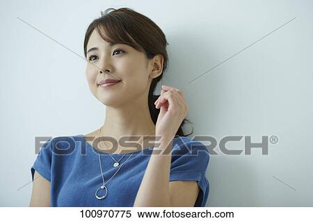 Studio portrait of attractive young Japanese woman View Large Photo Image Stock Photography - Studio portrait of attractive young Japanese woman. Fotosearch