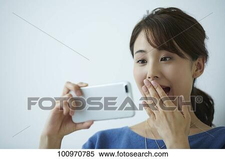 Studio portrait of attractive young Japanese woman View Large Photo Image Stock Photography - Studio portrait of attractive young Japanese woman. Fotosearch