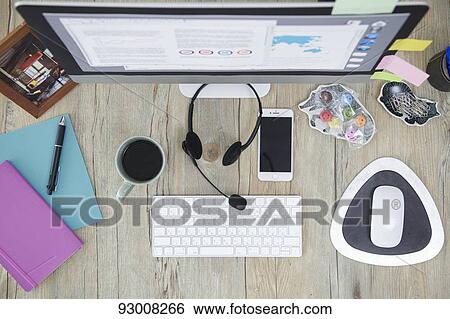 Stock Photograph - Top down view of working desk. Fotosearch