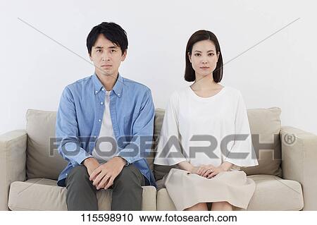 Stock Image - Unhappy Japanese family. Fotosearch