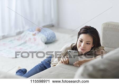 Unhappy Japanese mother with newborn baby View Large Photo Image Stock Image - Unhappy Japanese mother with newborn baby. Fotosearch