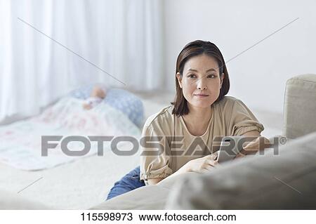 Unhappy Japanese mother with newborn baby View Large Photo Image Stock Image - Unhappy Japanese mother with newborn baby. Fotosearch