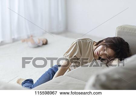Unhappy Japanese mother with newborn baby View Large Photo Image Stock Photo - Unhappy Japanese mother with newborn baby. Fotosearch