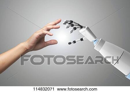 Stock Image - Woman and robot hands. Fotosearch
