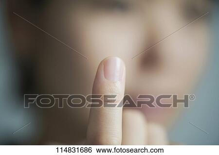Woman pointing finger up View Large Photo Image Stock Photograph - Woman pointing finger up. Fotosearch
