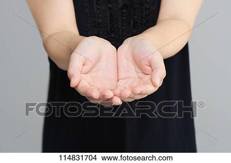 Picture - Woman showing hands. Fotosearch