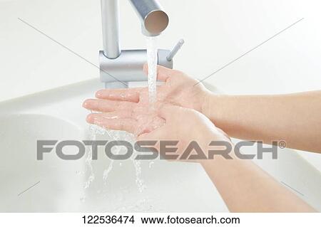 Picture - Woman washing hands. Fotosearch