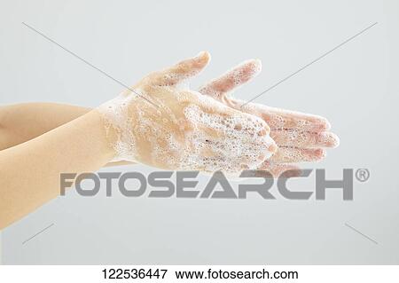 Stock Photo - Woman washing hands. Fotosearch