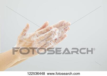 Stock Photo - Woman washing hands. Fotosearch
