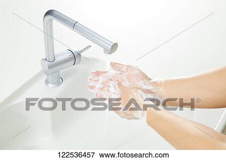 Woman washing hands View Large Photo Image Stock Photo - Woman washing hands. Fotosearch