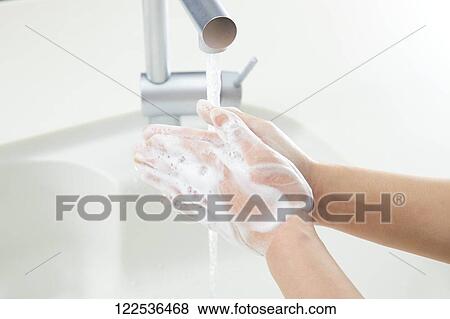 Woman washing hands View Large Photo Image Stock Photo - Woman washing hands. Fotosearch