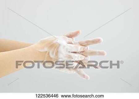Stock Photograph - Woman washing hands. Fotosearch