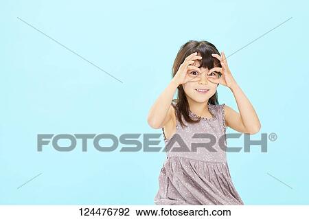 Stock Image - Young happy girl studio portrait. Fotosearch