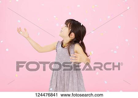 Stock Image - Young happy girl studio portrait. Fotosearch