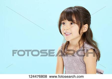 Young happy girl studio portrait View Large Photo Image Stock Photo - Young happy girl studio portrait. Fotosearch
