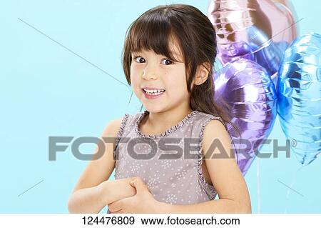 Stock Photo - Young happy girl studio portrait. Fotosearch