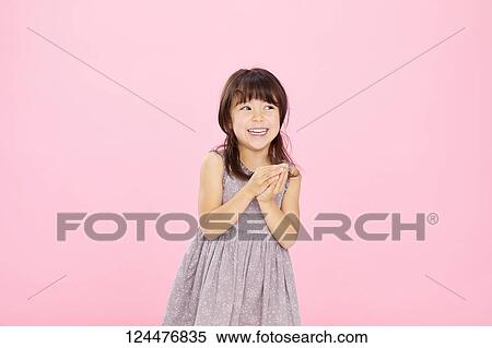 Stock Photography - Young happy girl studio portrait. Fotosearch