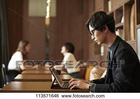 Young Japanese businessman at a cafe View Large Photo Image Stock Photograph - Young Japanese businessman at a cafe. Fotosearch
