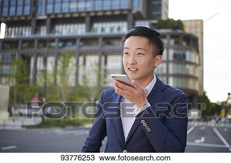 Young Japanese businessman downtown Tokyo View Large Photo Image Stock Image - Young Japanese businessman downtown Tokyo. Fotosearch