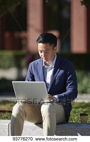 Young Japanese businessman downtown Tokyo View Large Photo Image Stock Image - Young Japanese businessman downtown Tokyo. Fotosearch