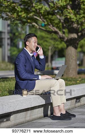 Young Japanese businessman downtown Tokyo View Large Photo Image Stock Image - Young Japanese businessman downtown Tokyo. Fotosearch