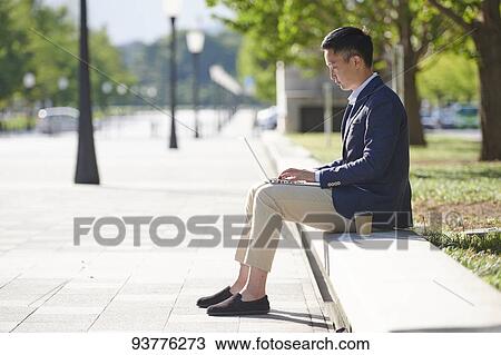 Young Japanese businessman downtown Tokyo View Large Photo Image Stock Image - Young Japanese businessman downtown Tokyo. Fotosearch