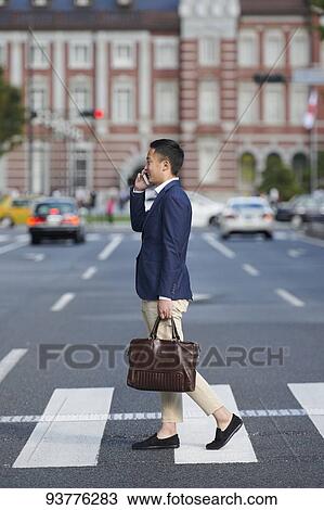 Young Japanese businessman downtown Tokyo View Large Photo Image Stock Image - Young Japanese businessman downtown Tokyo. Fotosearch