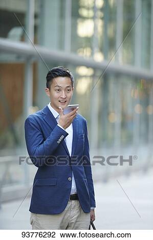 Young Japanese businessman downtown Tokyo View Large Photo Image Stock Image - Young Japanese businessman downtown Tokyo. Fotosearch