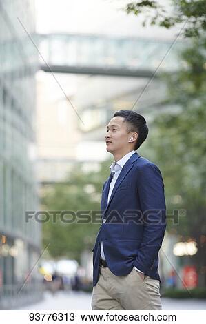 Young Japanese businessman downtown Tokyo View Large Photo Image Stock Image - Young Japanese businessman downtown Tokyo. Fotosearch