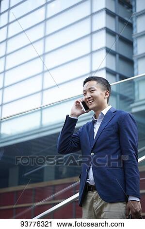 Young Japanese businessman downtown Tokyo View Large Photo Image Stock Image - Young Japanese businessman downtown Tokyo. Fotosearch