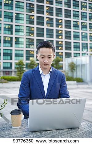 Young Japanese businessman downtown Tokyo View Large Photo Image Stock Image - Young Japanese businessman downtown Tokyo. Fotosearch