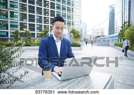 Young Japanese businessman downtown Tokyo View Large Photo Image Stock Image - Young Japanese businessman downtown Tokyo. Fotosearch