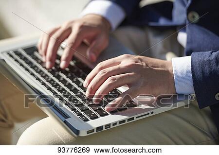 Stock Photo - Young Japanese businessman downtown Tokyo. Fotosearch