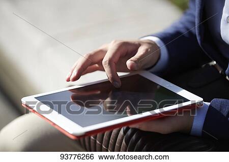 Stock Photograph - Young Japanese businessman downtown Tokyo. Fotosearch