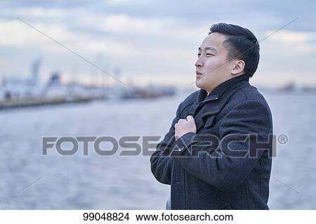 Young Japanese businessman outside View Large Photo Image Picture - Young Japanese businessman outside. Fotosearch
