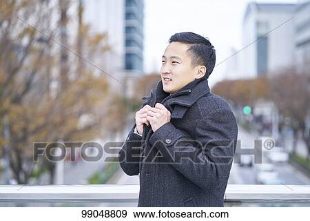 Young Japanese businessman outside View Large Photo Image Stock Photo - Young Japanese businessman outside. Fotosearch