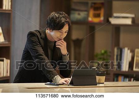 Stock Image - Young Japanese businessman. Fotosearch
